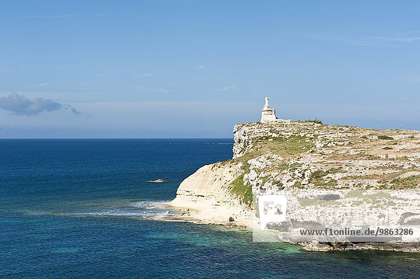 Rocky small island with monument  St. Paul?s Islands  Il-G?ejjer ta 'San Pawl  Malta  Europe