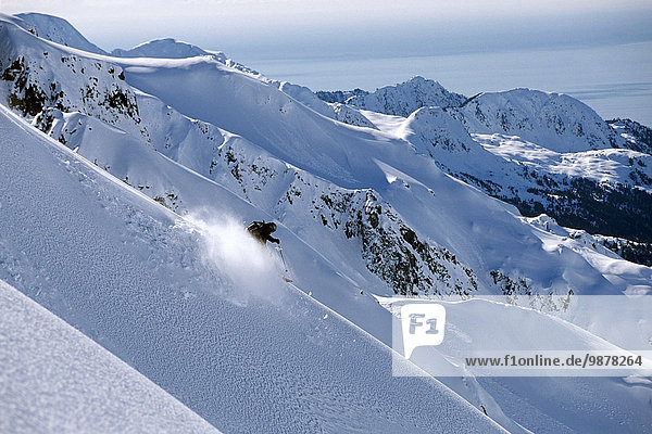 Backcountry Skier Skiing Down Ridge Resurrection Peninsula W/Gulf Of Alaska Background Kp Alaska Winter
