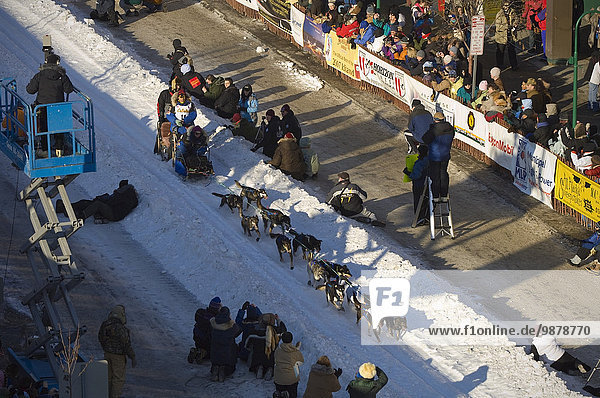 Overhead View Of Martin Buser Leaving The Starting Line Of The 2007 Iditarod Sled Dog Race In Anchorage Alaska