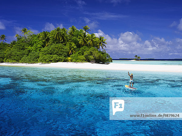 'Paddle boarding off a remote island; Marshall Islands'