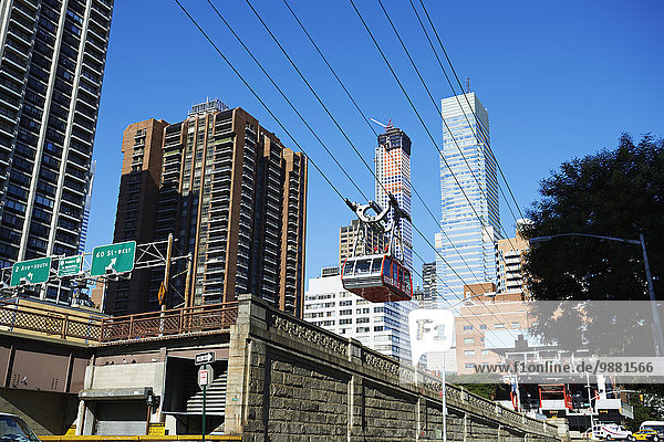 'Roosevelt Island tram leaving Manhattan; New York City  New York  United States of America'