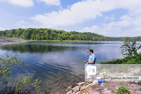 'Man fishing at pond in Hilton Falls Conservation Area; Campbellville  Ontario  Canda'