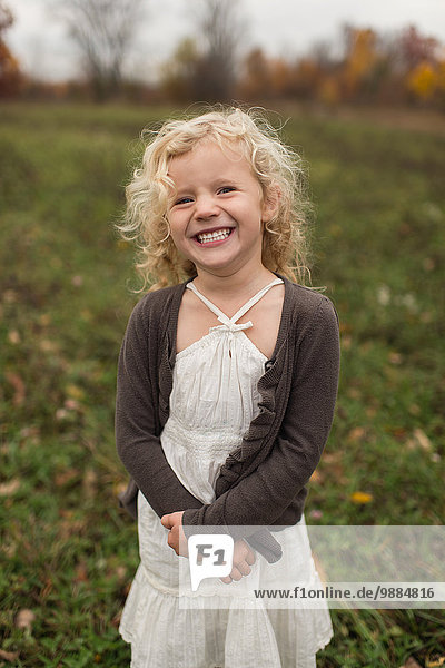 Portrait of young girl smiling  outdoors