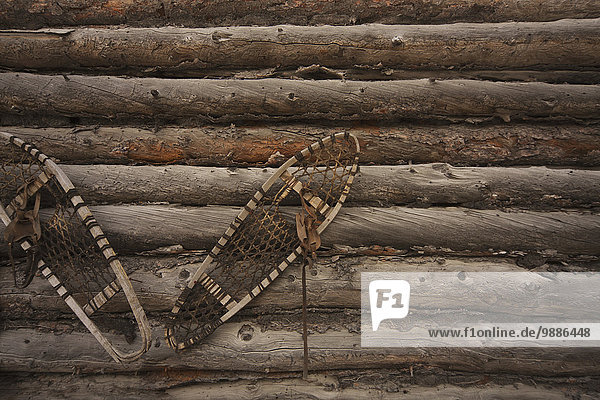 Snowshoes on old log house; Yellowknife  Northwest Territories  Canada