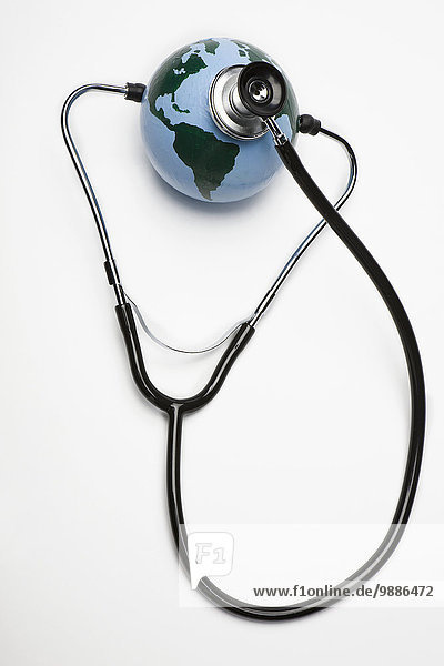 Globe with a stethoscope