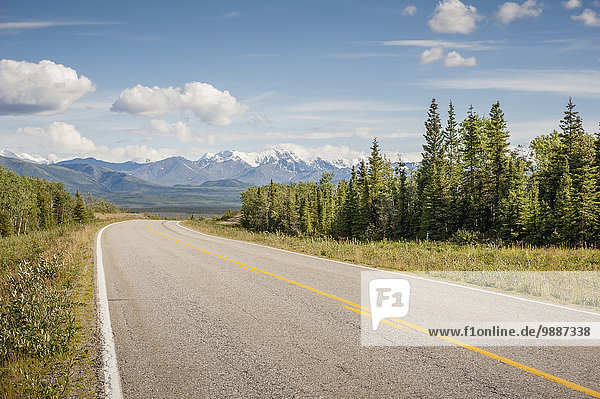 Looking down the Richardson Highway at a distant mountain range  Alaska  Summer