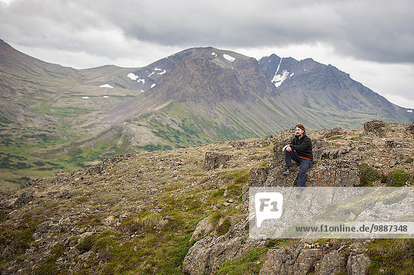 Male hiker along Flat Top Mountain trail near Anchorage  Chugach Mountains  Southcentral Alaska  Summer