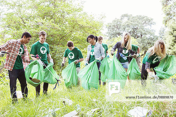 Environmentalist volunteers picking up trash