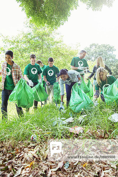 Environmentalist volunteers picking up trash
