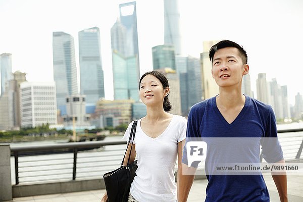 Couple strolling on the waterfront  The Bund  Shanghai  China