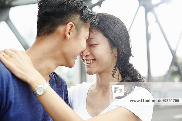 Close up of smiling romantic couple  The Bund  Shanghai  China