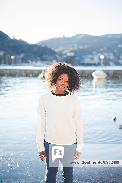 Portrait of young woman on lakeside  Lake Como  Italy