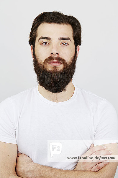 Portrait of bearded man in white t-shirt