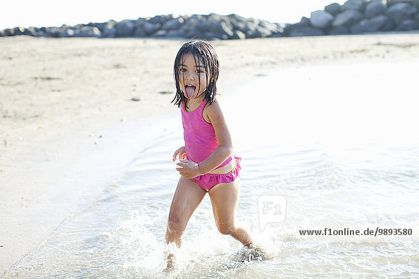 Girl playing on beach  Maui  Hawaii  US