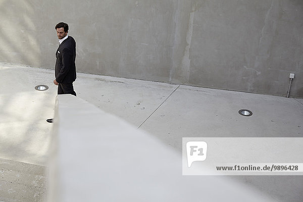 Portrait of businessman walking in a modern building