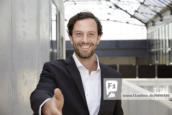 Portrait of smiling businessman in a modern building