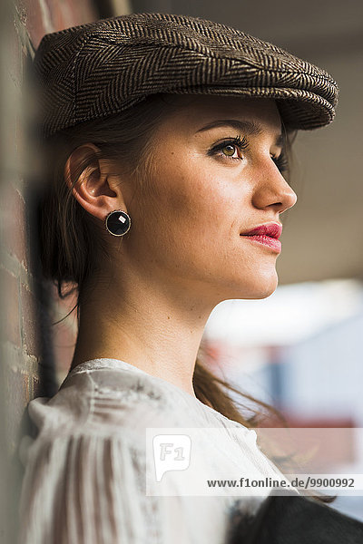 Young woman wearing cap outdoors