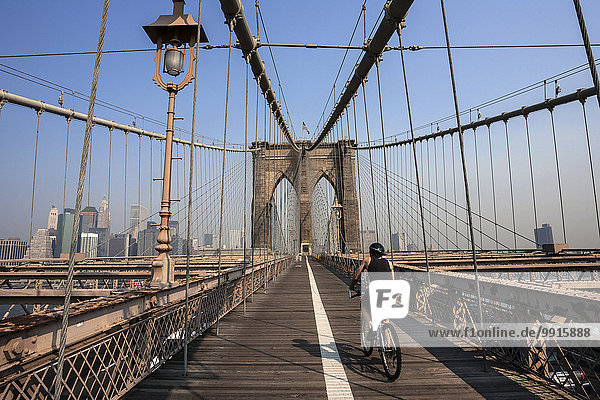 Brooklyn Bridge  skyline of Lower Manhattan behind on the left  New York  USA