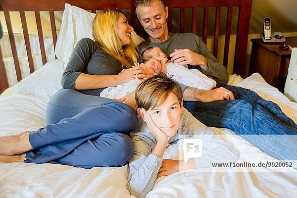 Couple with son and newborn twin girl and boy