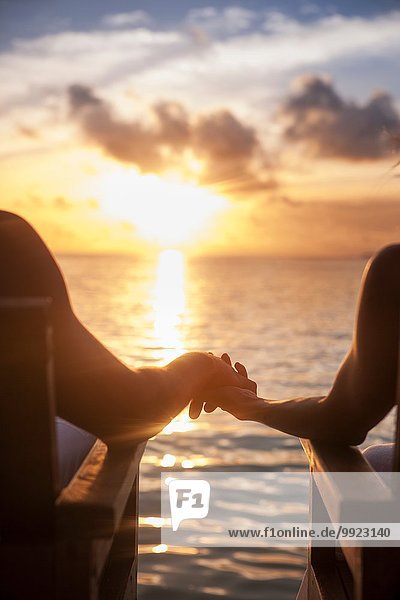 Couple holding hands on vacation