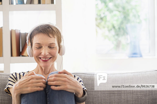 Smiling senior woman with headphones