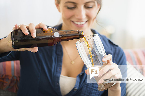 Woman pouring beer