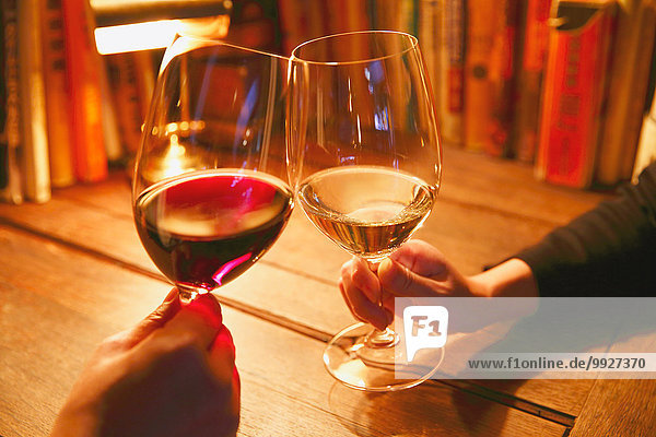 Couple toasting with wine in a fashionable bar
