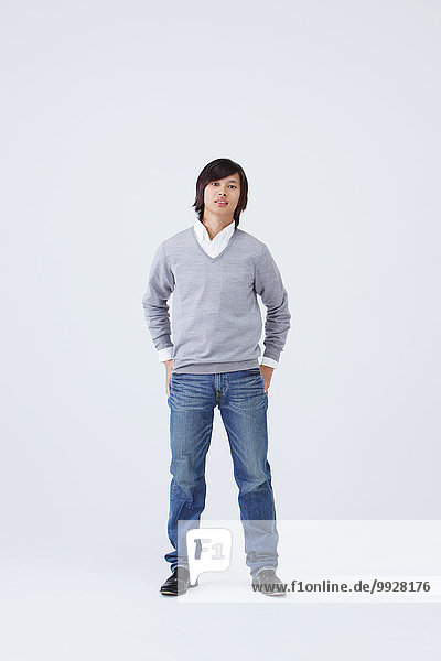 Full body view of young man wearing jeans