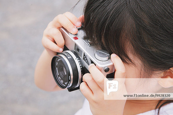 Young girl with camera