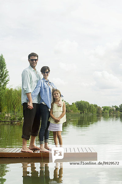 Family standing on dock  portrait