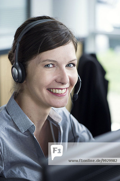 Receptionist smiling cheerfully  portrait