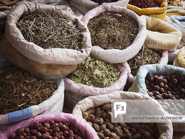 Sacks of dried spices for sale in market