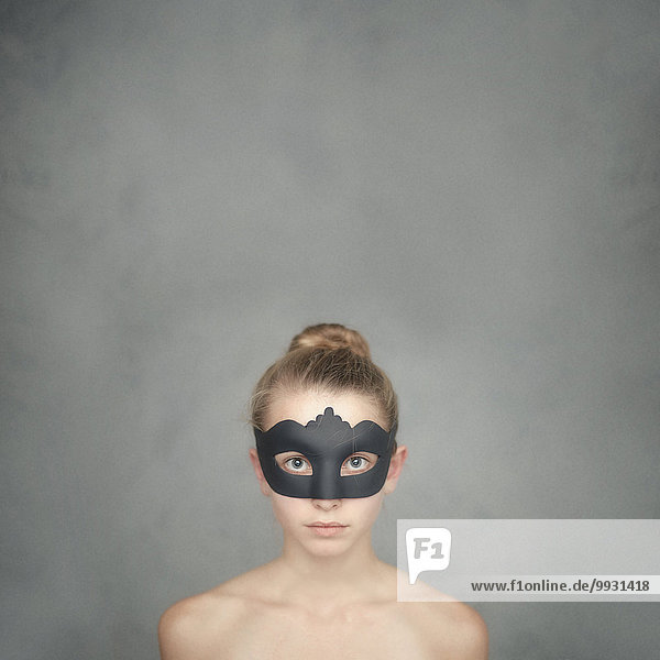 Caucasian girl wearing black mask