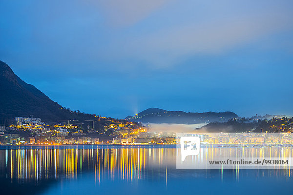 Farbaufnahme Farbe Europa Berg Himmel See blau Stunde Lugano Schweiz