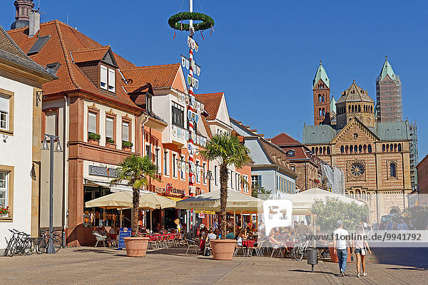 Europe  Germany  Europe  Rhineland-Palatinate  Speyer  Maximilianstrasse  Old Town  street scene  maypole  Kaiserdom  cathedral  church  Saint Maria and Saint Stephan  architecture  building  place of interest  tourism  historical  trees  gastronomy  person  persons  church  plants  tower  restaurant  street
