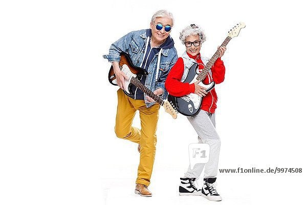 Two fashion of elderly people playing the guitar