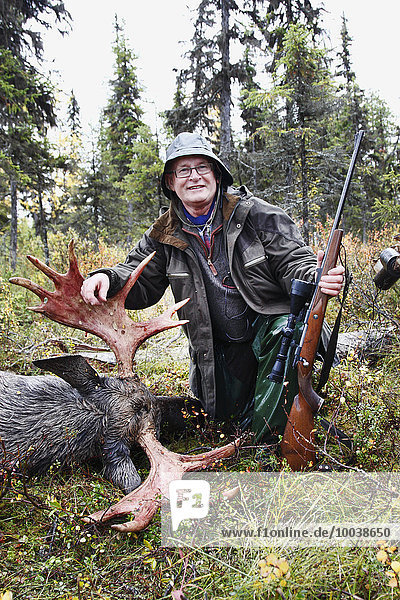 Hunter with killed elk