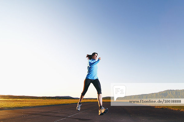 Woman jogging at dusk