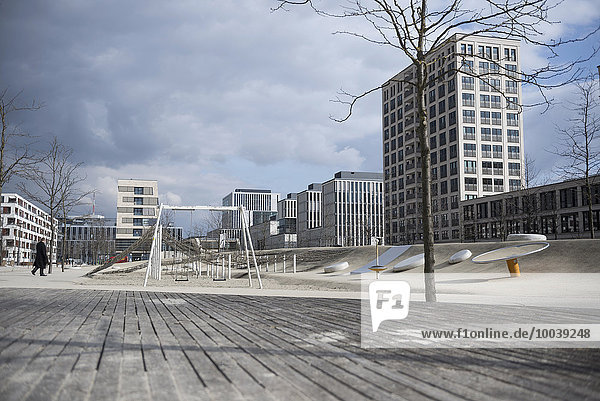 Playground surrounded by modern buildings in city  Munich  Bavaria  Germany