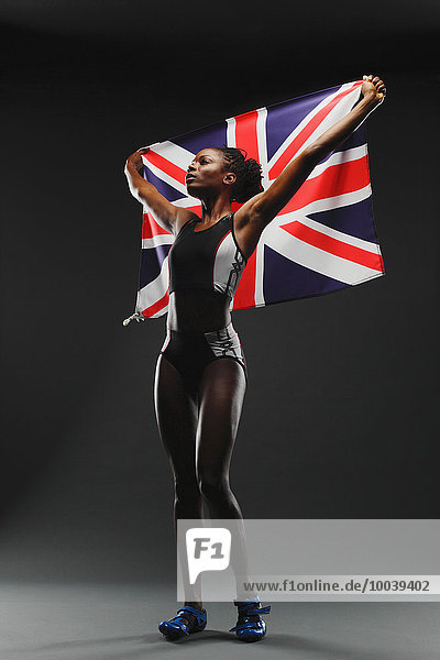 Female Athlete Holding a British Flag