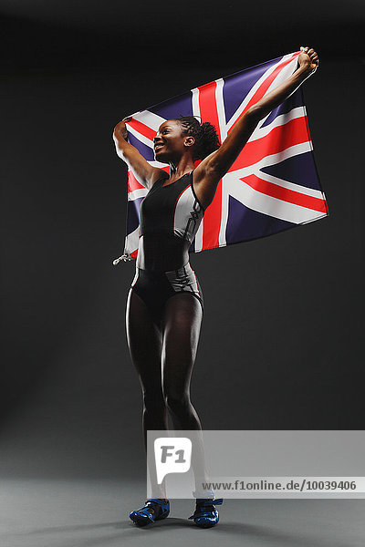 Female Athlete Holding a British Flag