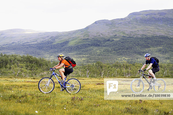 Young couple cycling