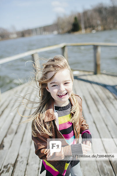 Laughing girl on jetty