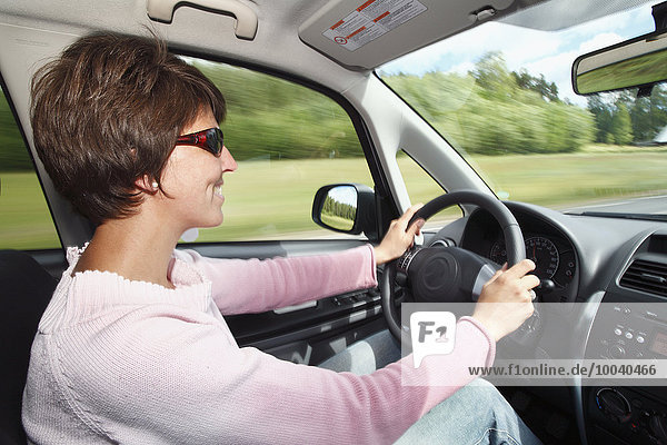 Smiling woman driving