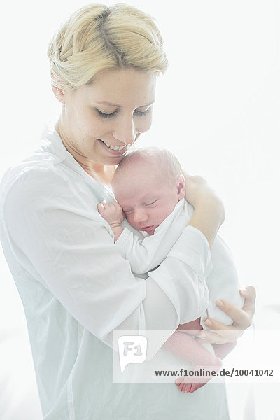 Young woman with newborn baby