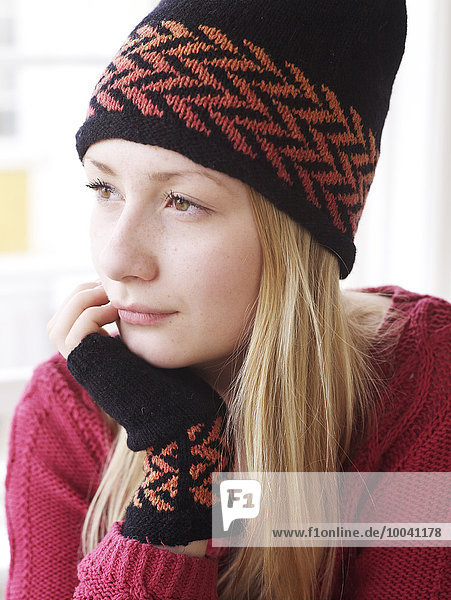 Young woman wearing knitted hat