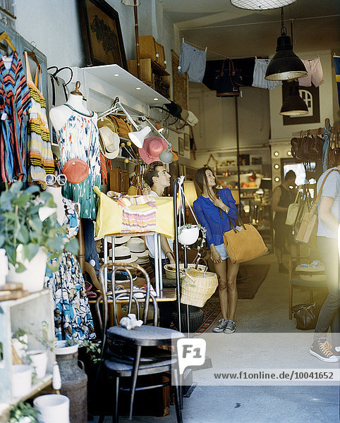 Young woman in second hand store