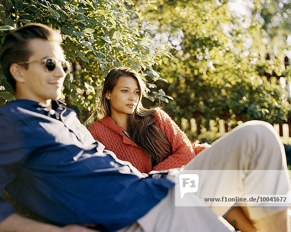 A young couple in a park.