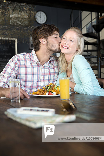 Young couple in a restaurant having lunch