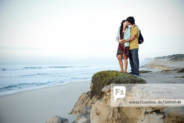 South Africa  kissing couple standing at the coast